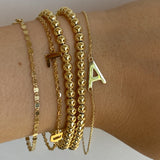 gold bracelets stacked