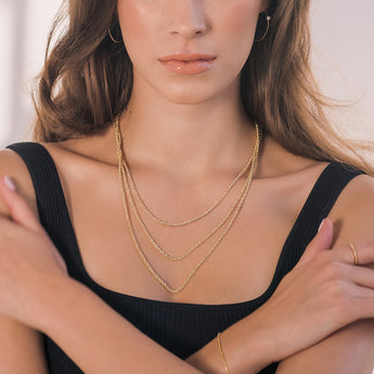 three yellow gold rope chains